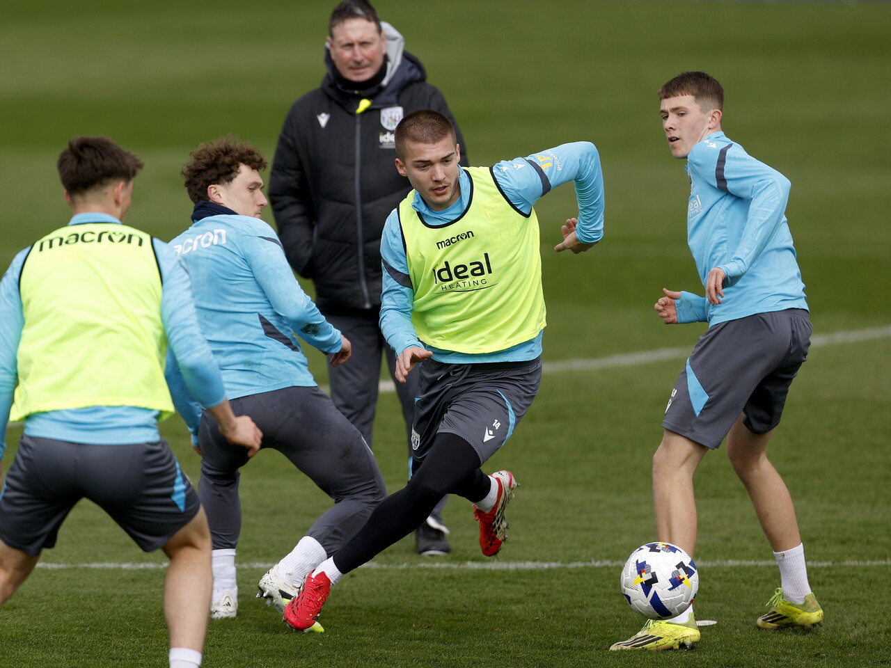 Four Albion players battling for the ball during training 
