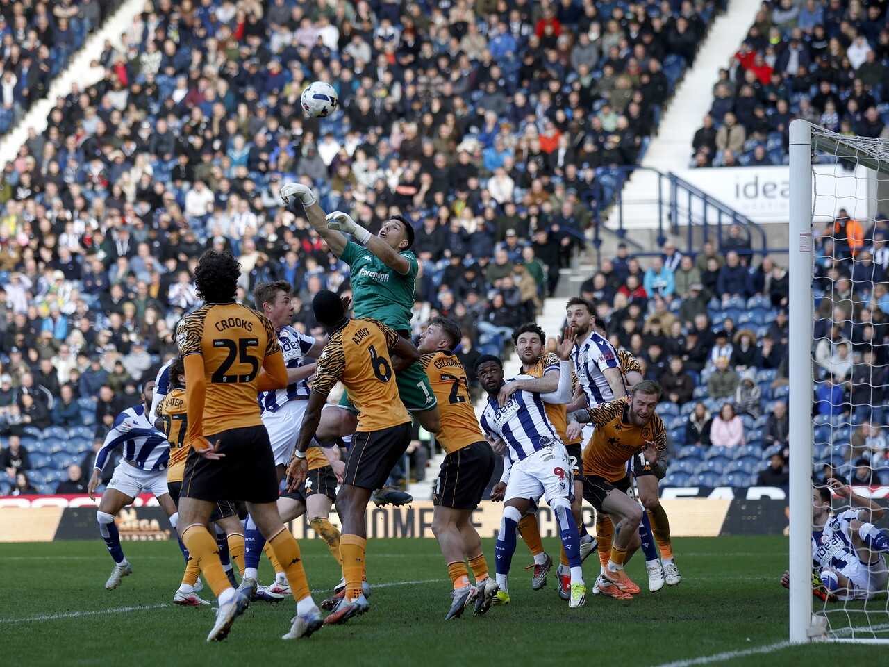 Several WBA & Hull players jumping to try and win an aerial ball in a penalty area