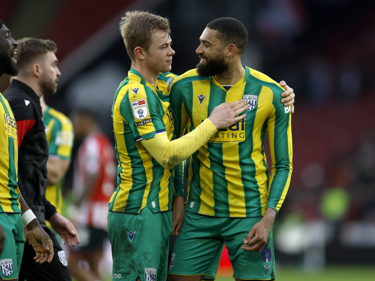 George Campbell and Aune Heggebø smiling and talking after the Sheffield United game