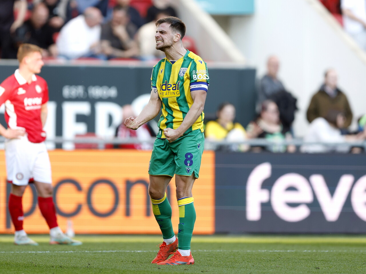 Jayson Molumby celebrates at full-time