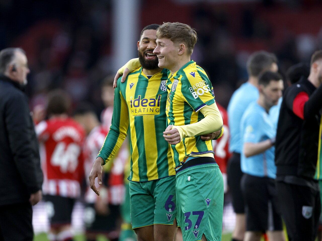 George Campbell and Ollie Bostock smiling and talking after the Sheffield United game