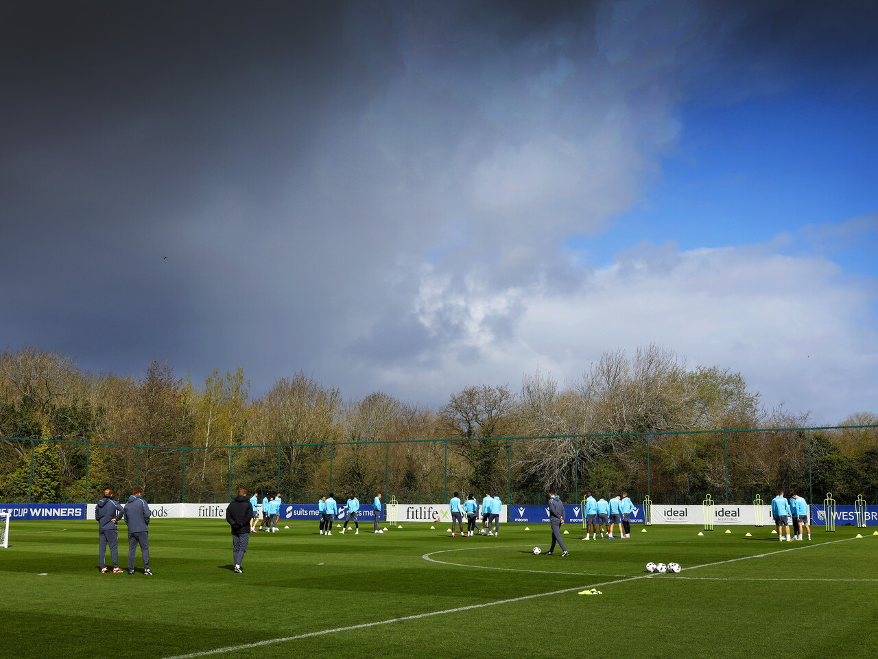 A general shot of the training pitch with the blue and grey skies above 