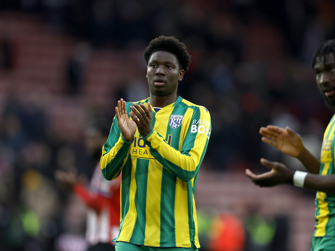 Jamal Jimoh-Aloba applauding WBA fans after the Sheffield United game