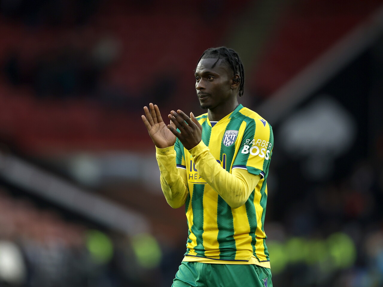 Ousmane Diakité applauding WBA fans after the Sheffield United game