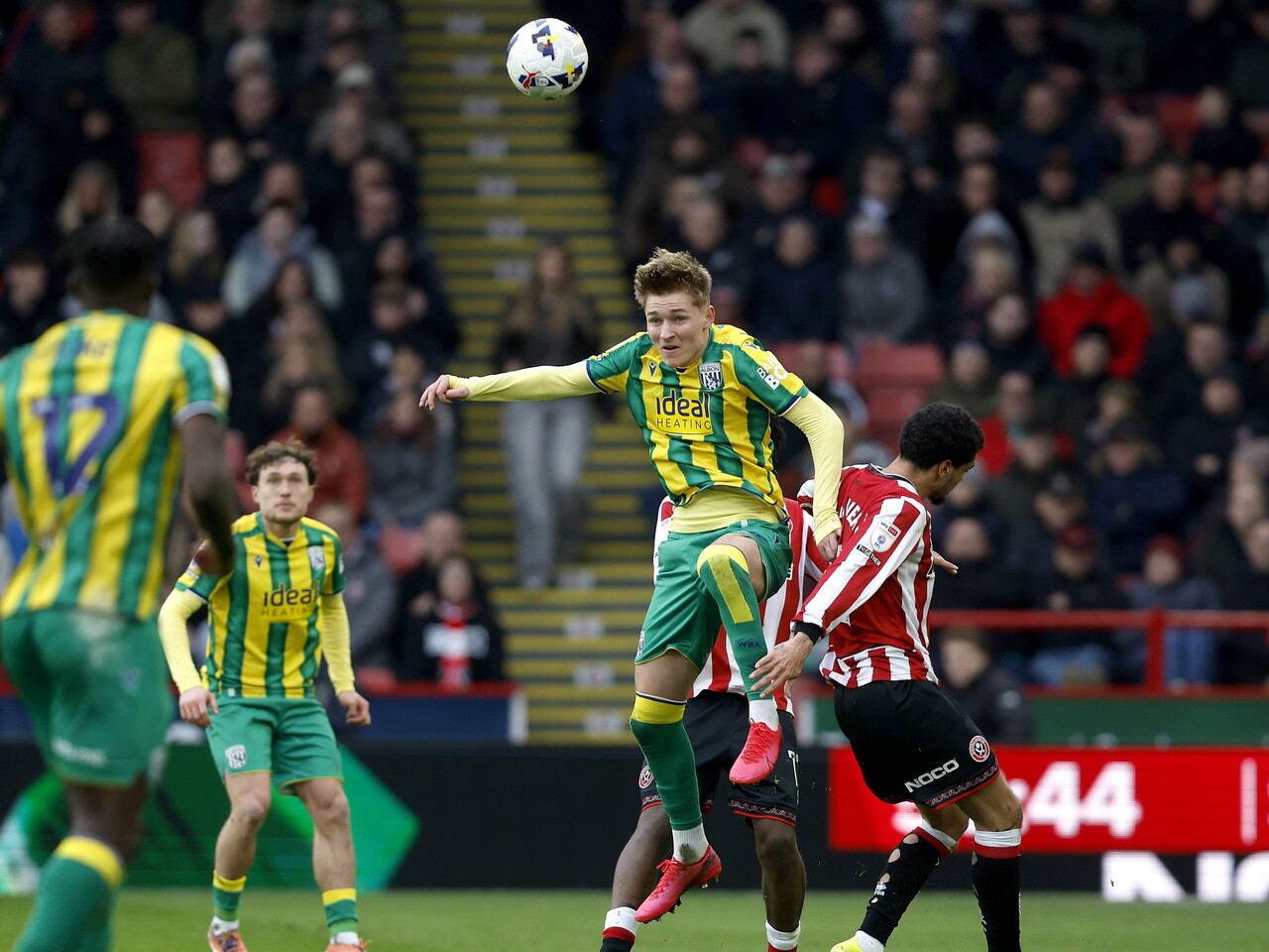 Ollie Bostock jumping for a header against Sheffield United 