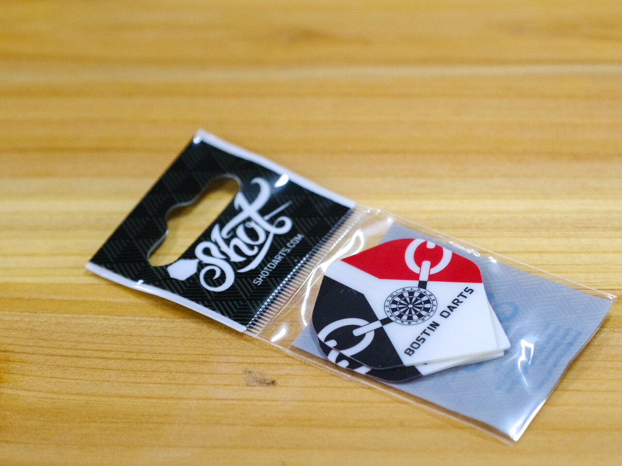 Bostin Darts flights on a table.