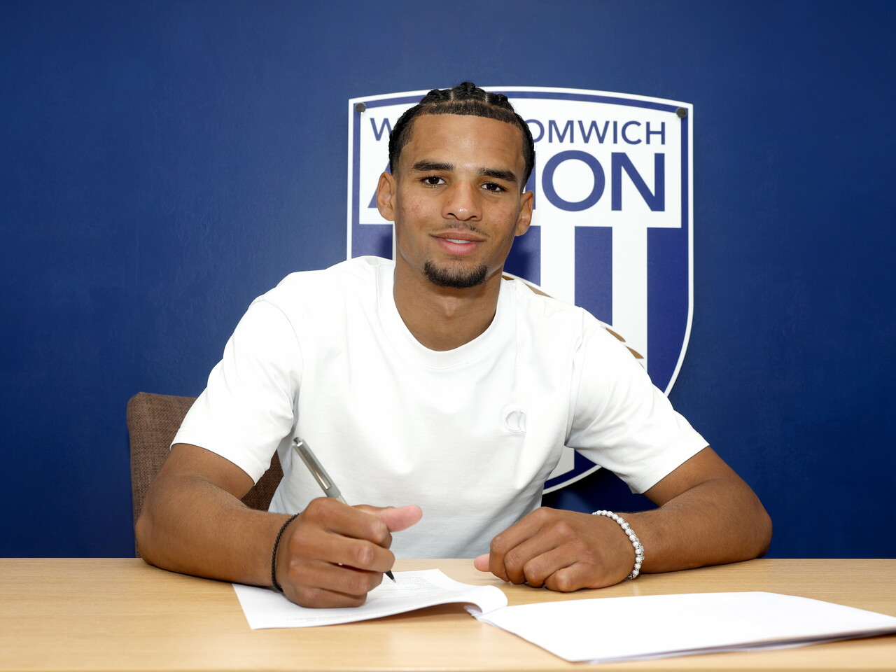 Antonio Perkins signing his first professional deal.