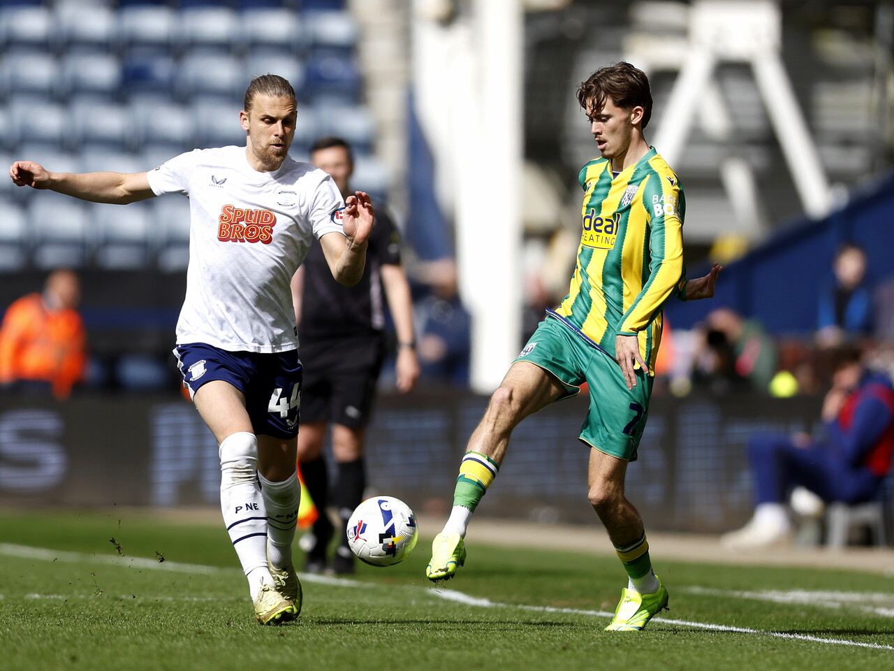 Isaac Price passes the ball against Preston
