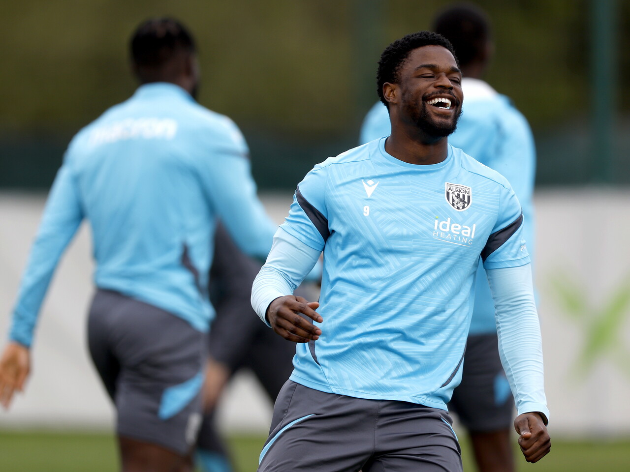 Josh Maja laughing while warming up