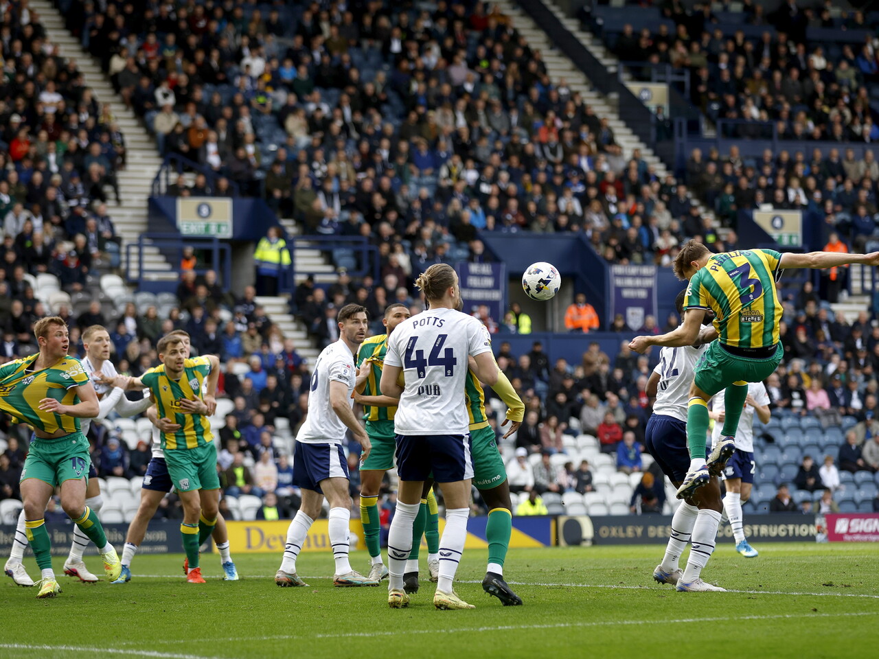 Nat Phillips heads the ball at goal against Preston