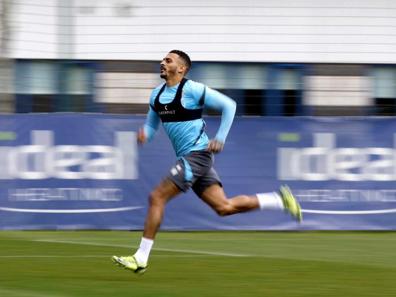 Karlan Grant running forward at speed during a training session