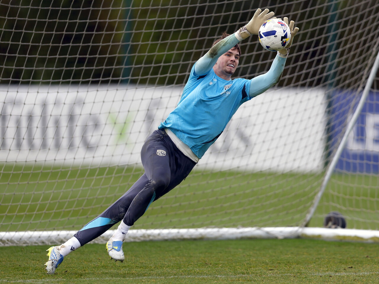 Josh Griffiths catching a ball during training 