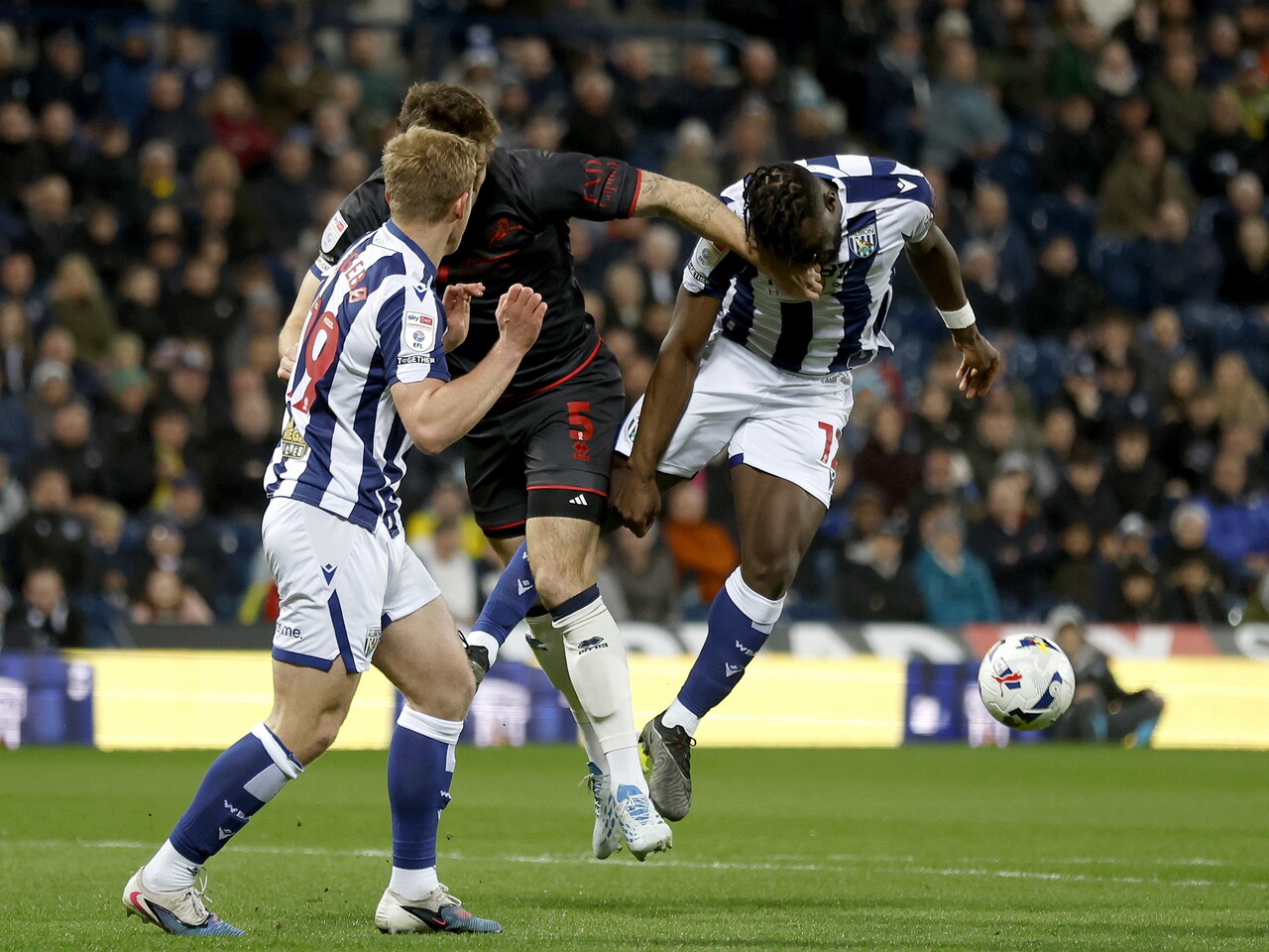 Daryl Dike battles to win a header against Millwall 