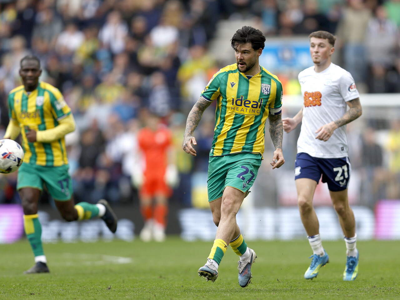 Alex Mowatt passes the ball against Preston