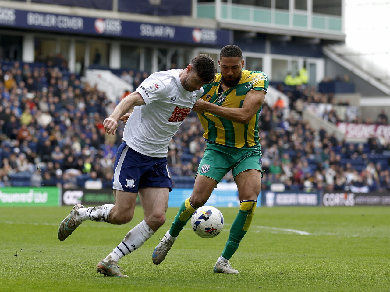 George Campbell battles for the ball against Preston