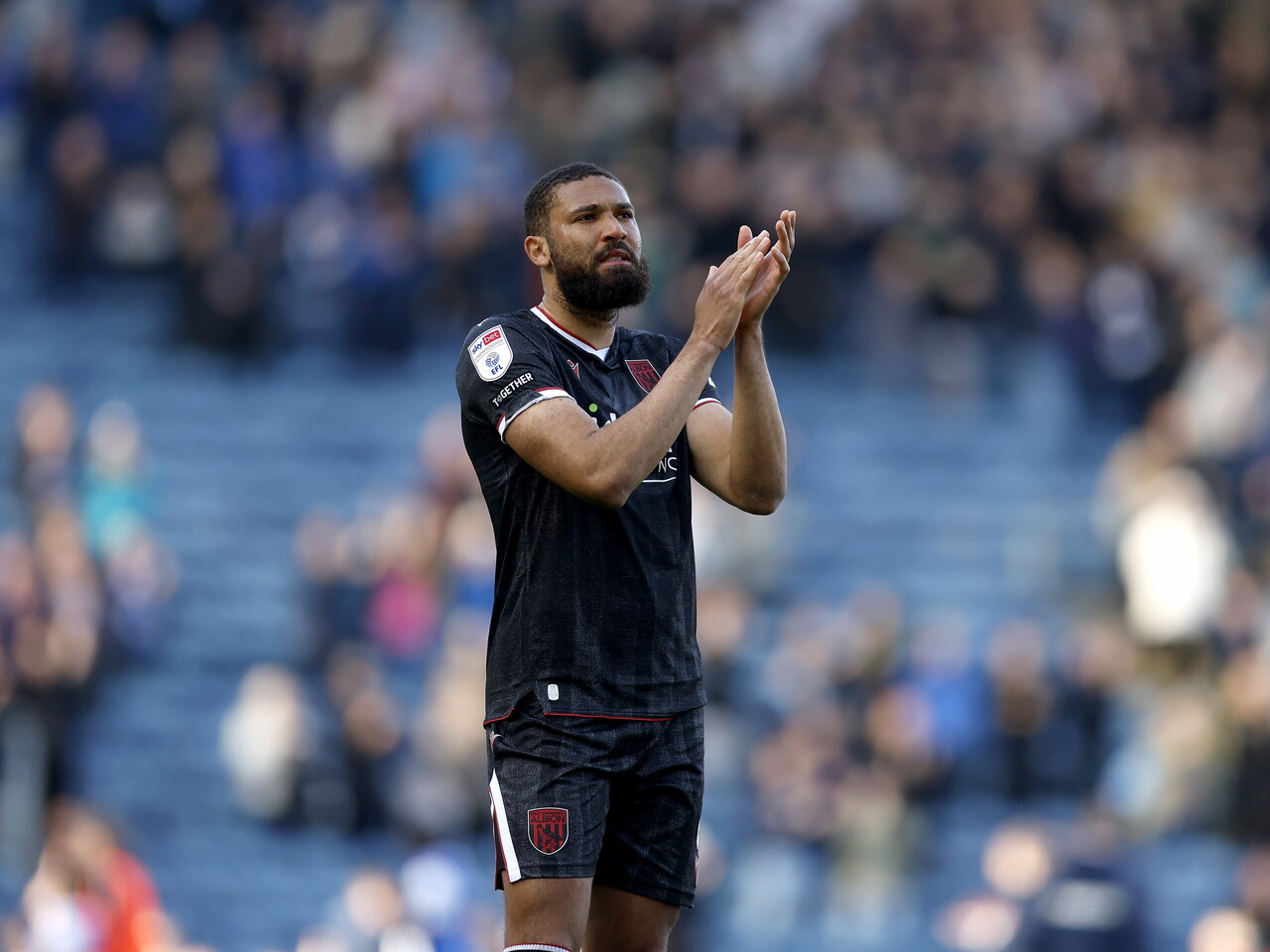 George Campbell applauds the fans