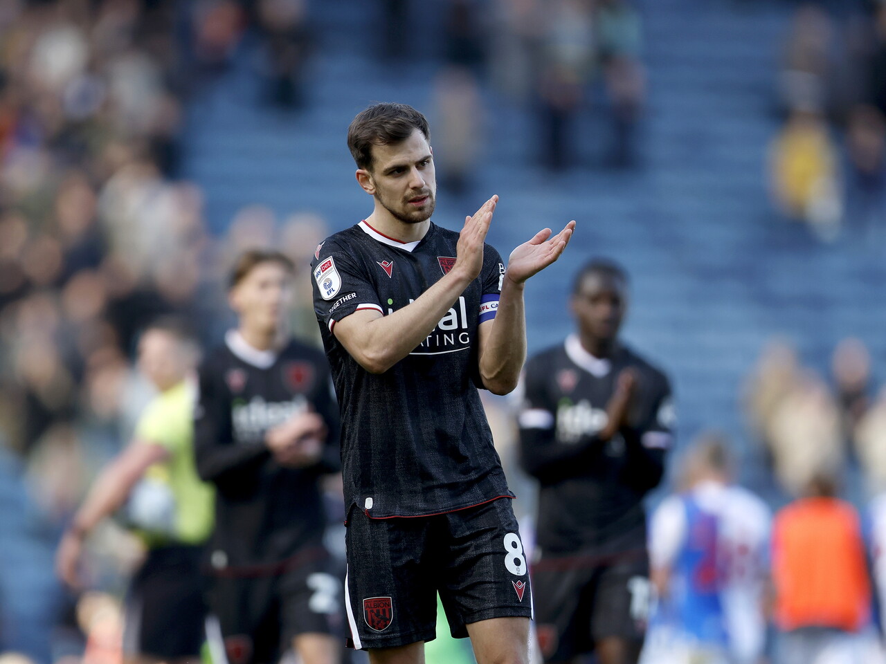 Jayson Molumby applauds the fans