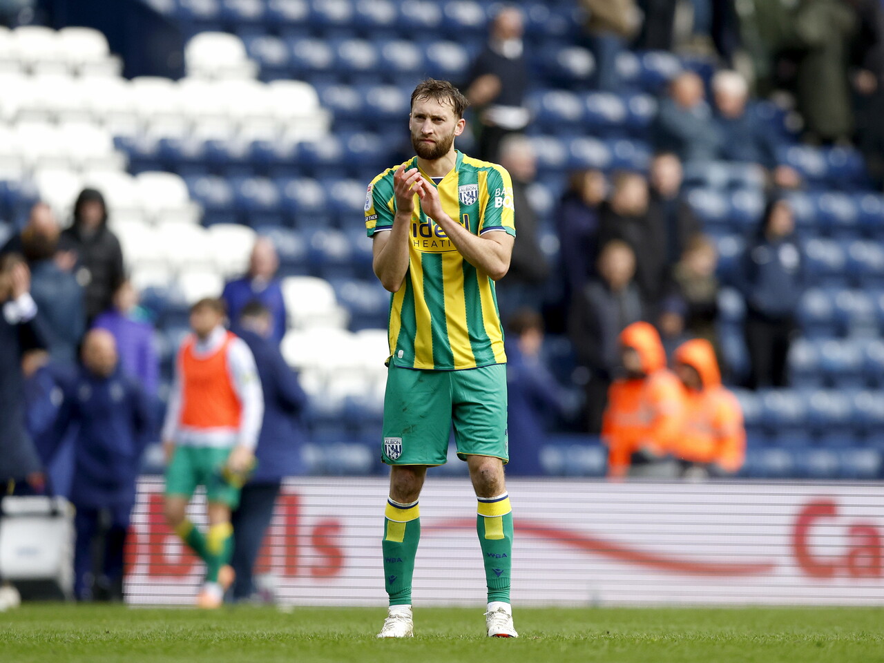 Nat Phillips applauds the fans at full-time