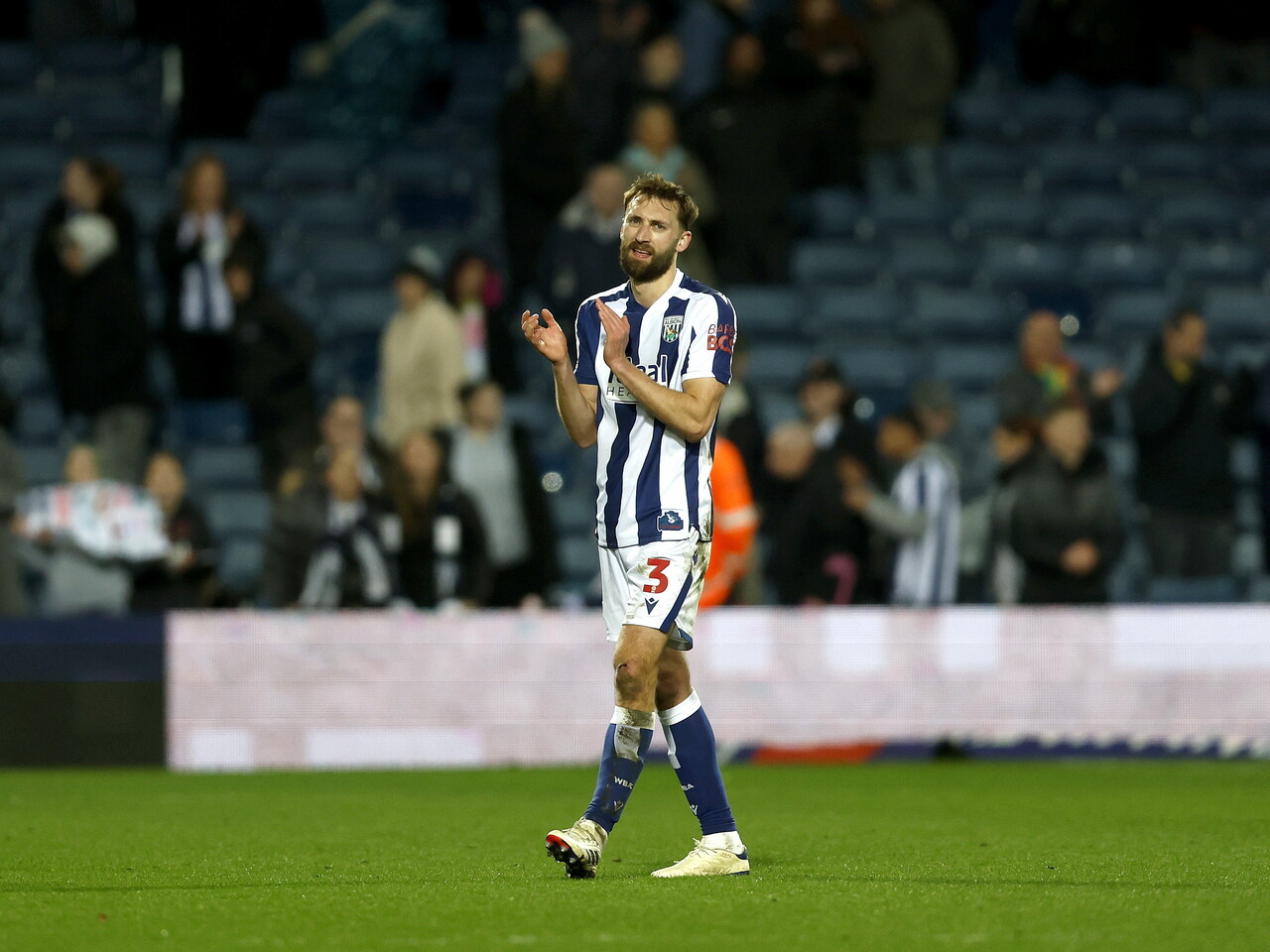 Nat Phillips applauding WBA fans after the Millwall game
