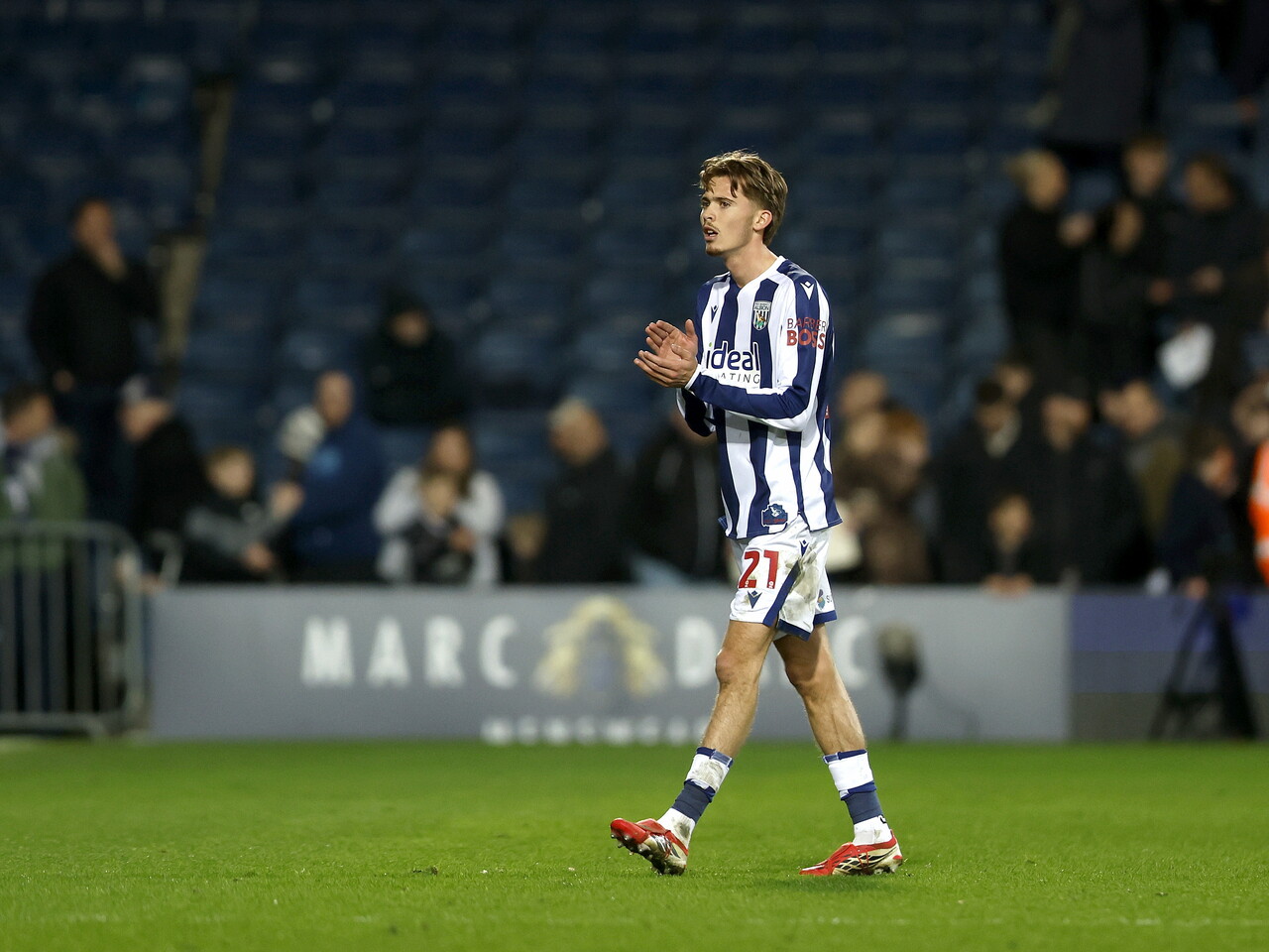 Isaac Price applauding WBA fans after the Millwall game