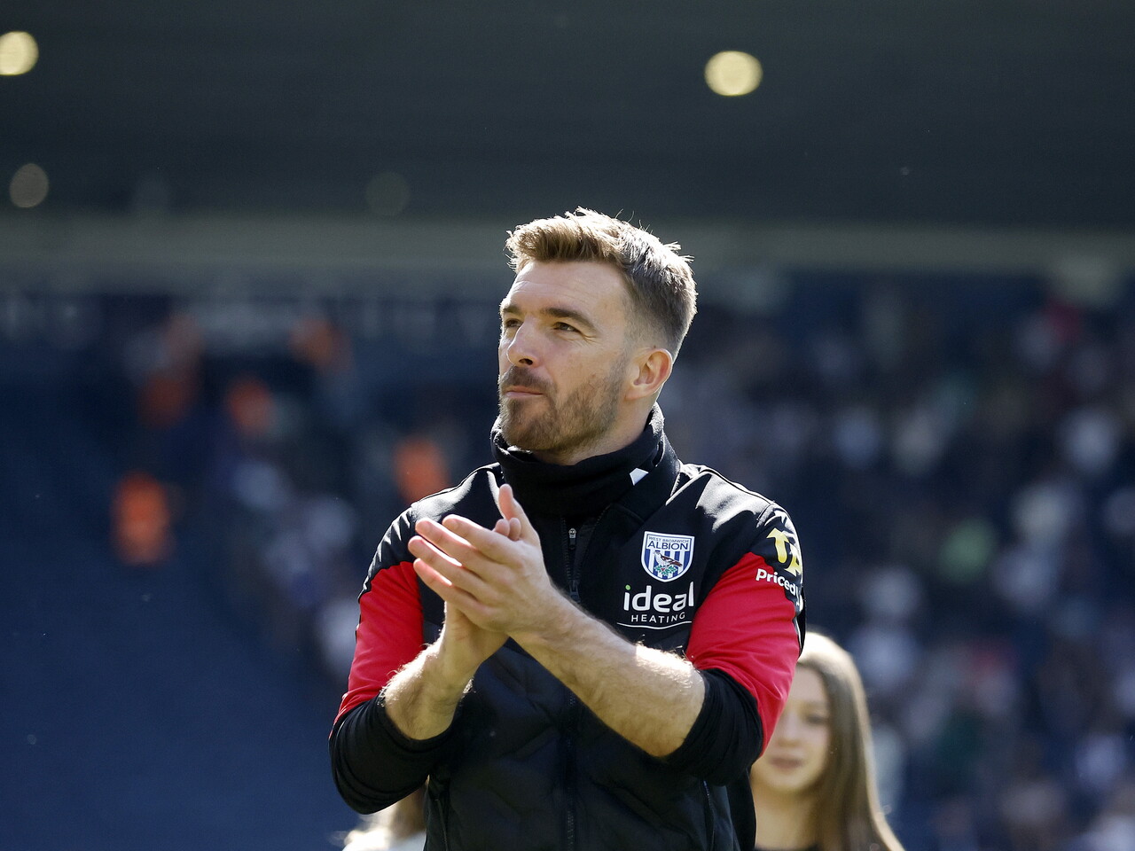 James Morrison applauding and celebrating with WBA fans after the Ipswich game