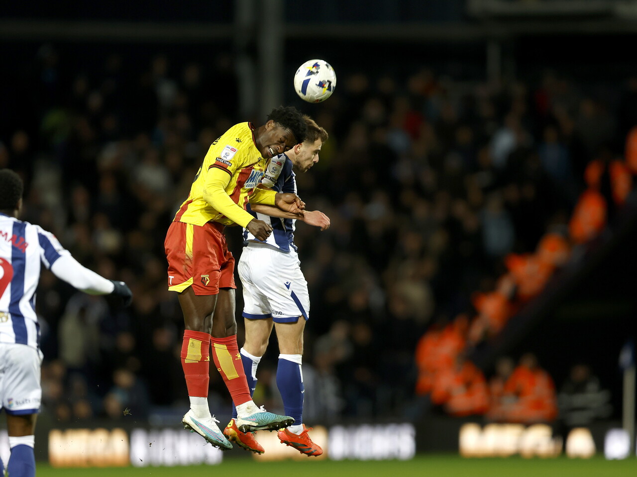 Jayson Molumby heads the ball against Watford