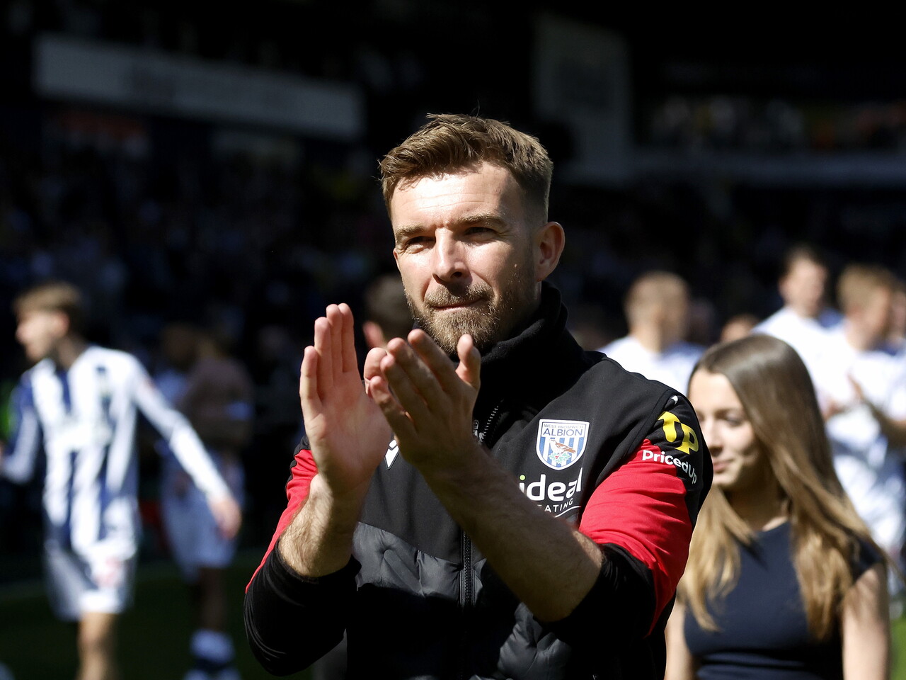 James Morrison applauding and celebrating with WBA fans after the Ipswich game