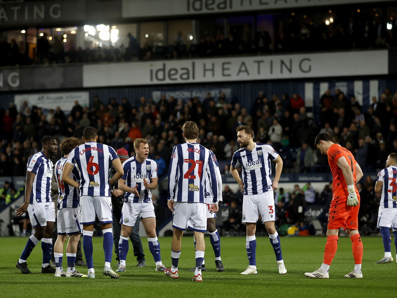 Several Albion players in a group on the pitch moments before kick-off against Millwall