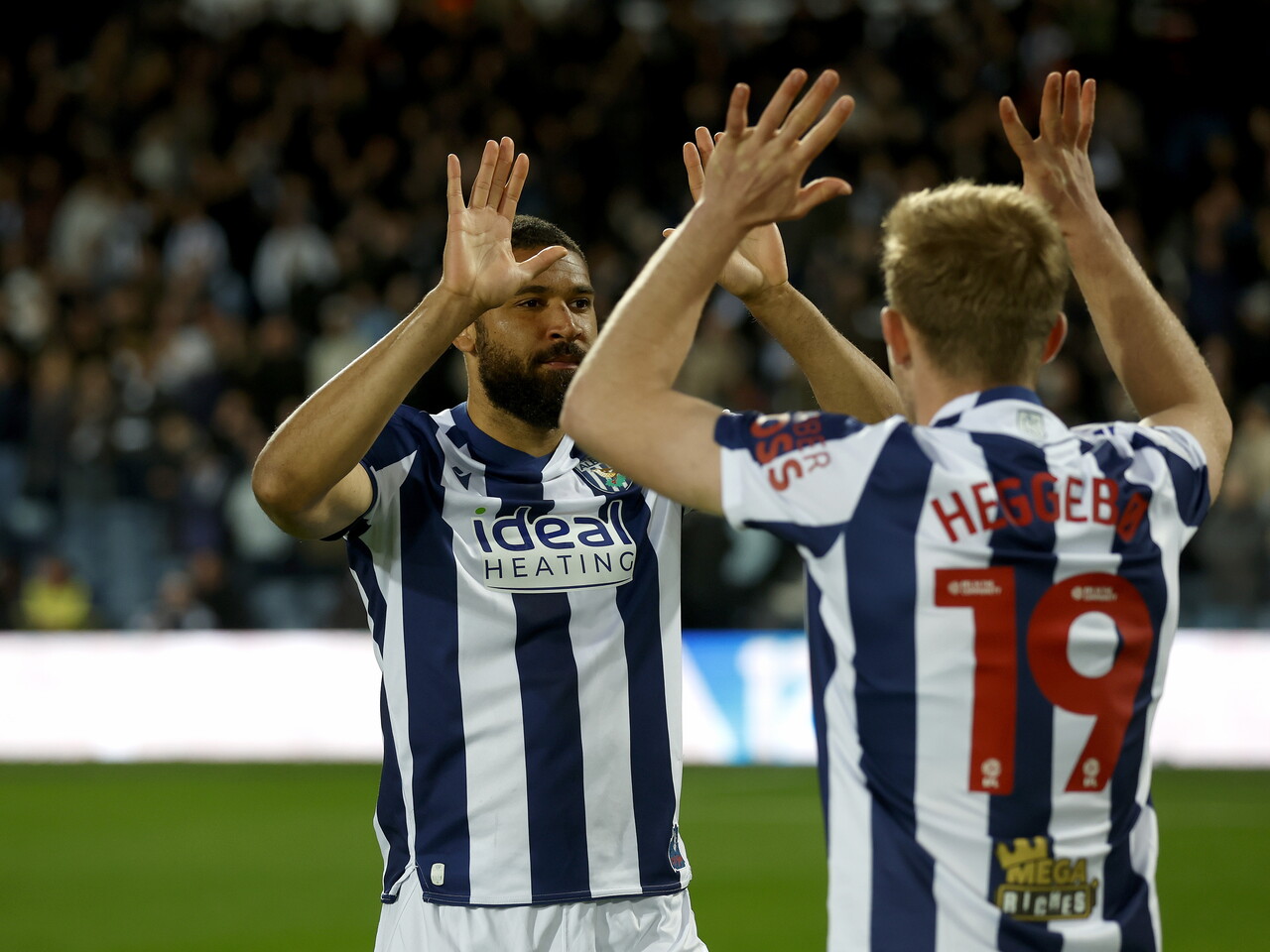 George Campbell and Aune Heggebø high-fiving before the Millwall game 