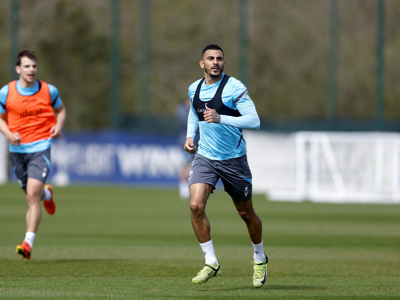 Karlan Grant running forward during training