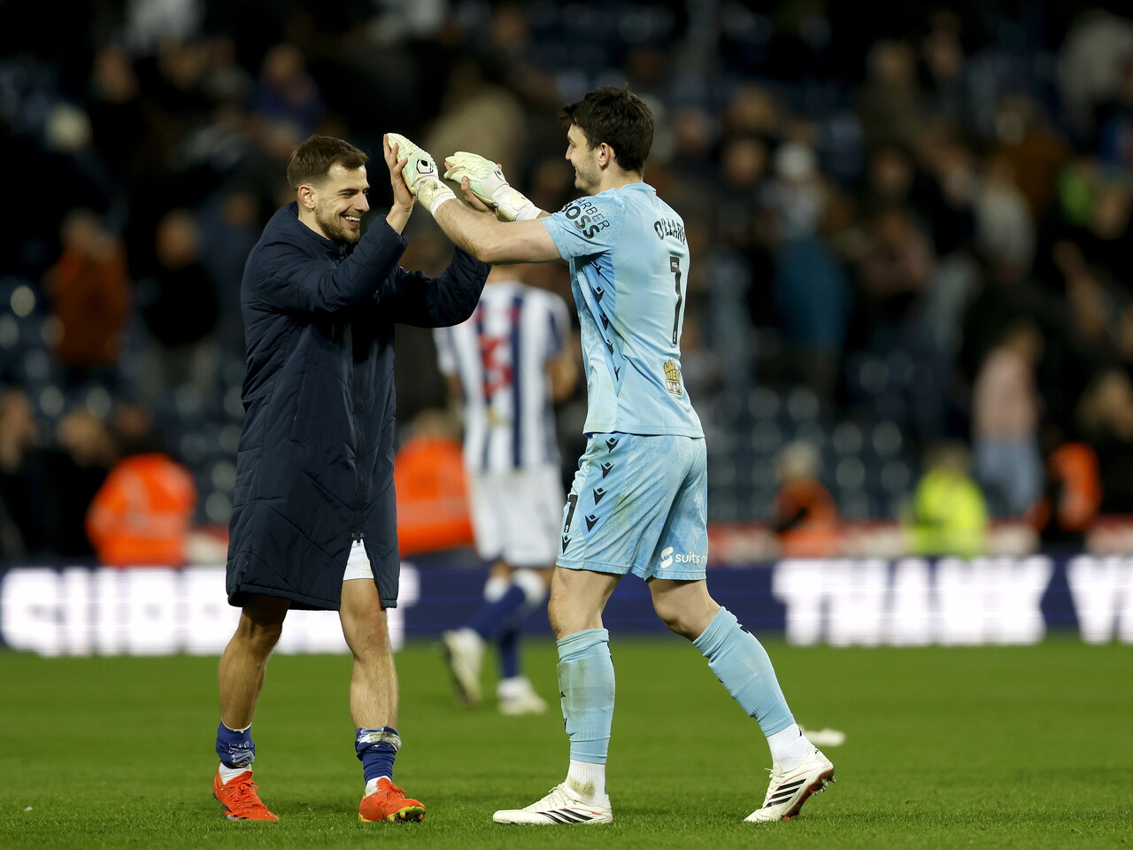 Max O'Leary and Jayson Molumby celebrate at full-time