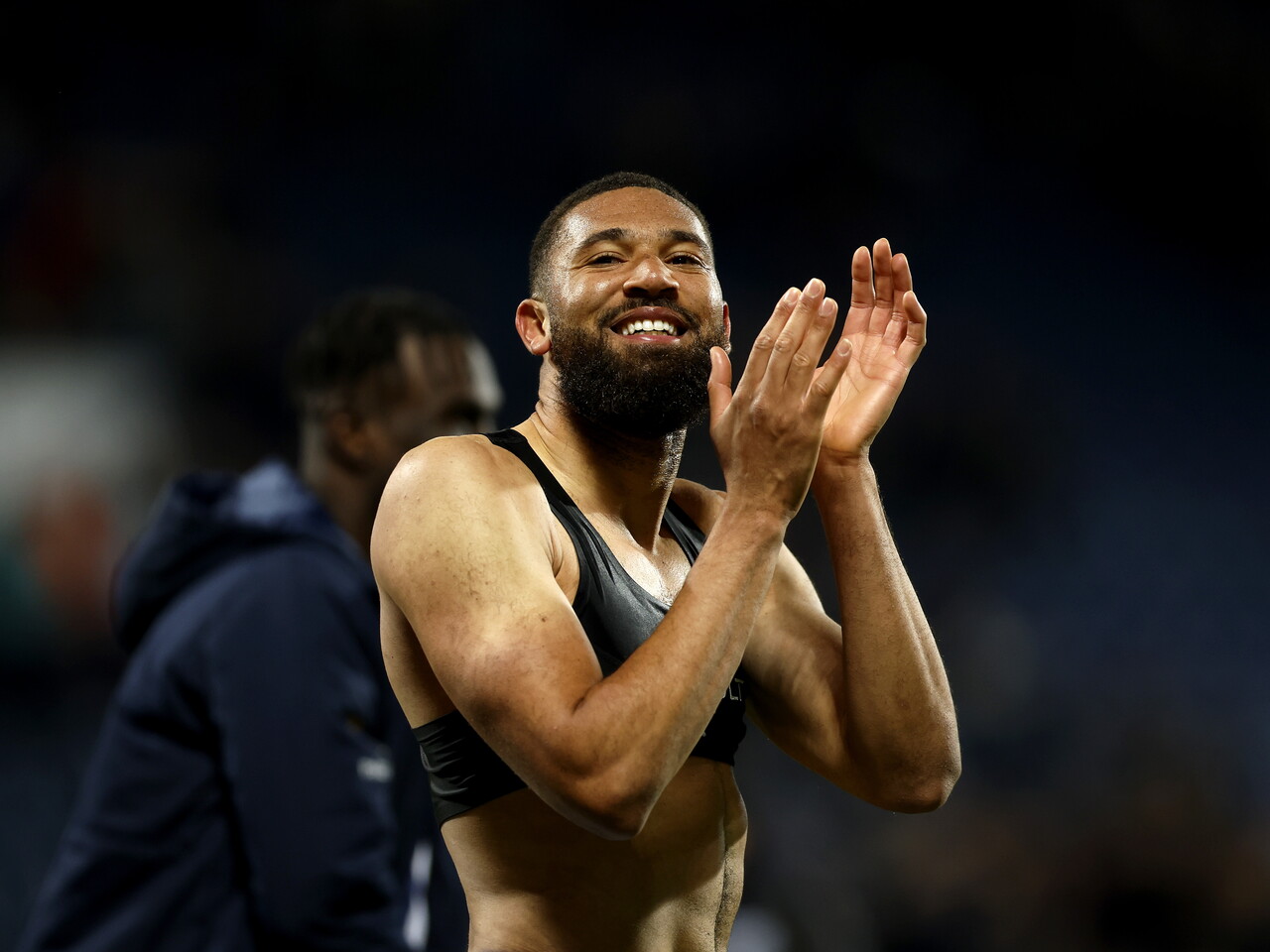 George Campbell applauds the fans at full-time