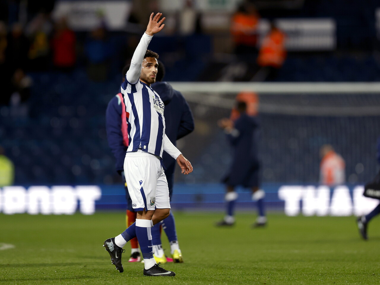 Tammer Bany applauds the fans at full-time