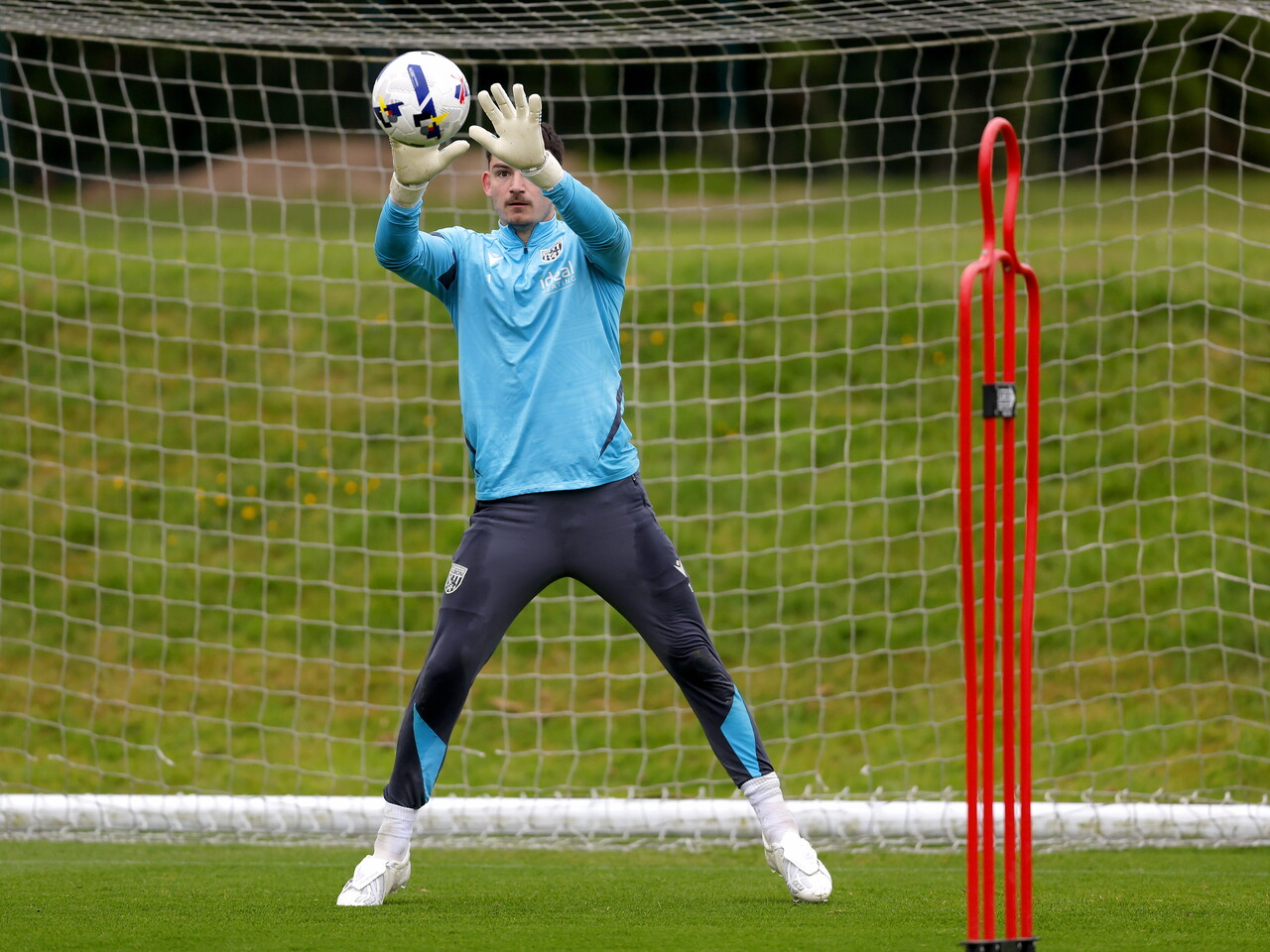 Max O'Leary catching a ball in training