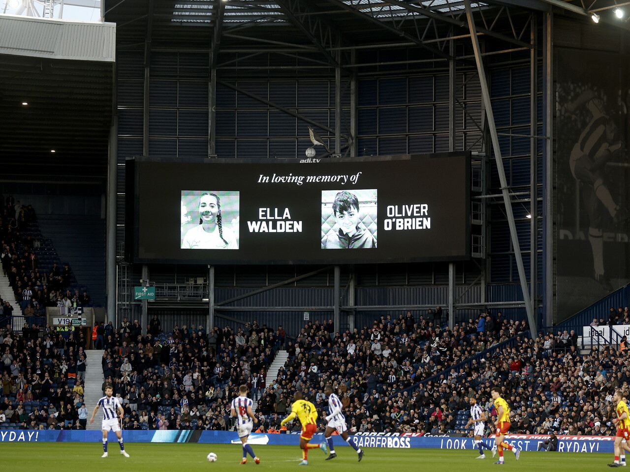 The scoreboard in the 13th minute for an applause in memory of Ella Walden and Oliver O'Brien