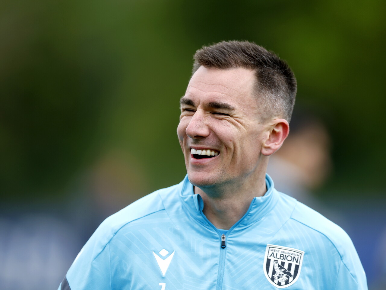 Jed Wallace smiling during a training session 