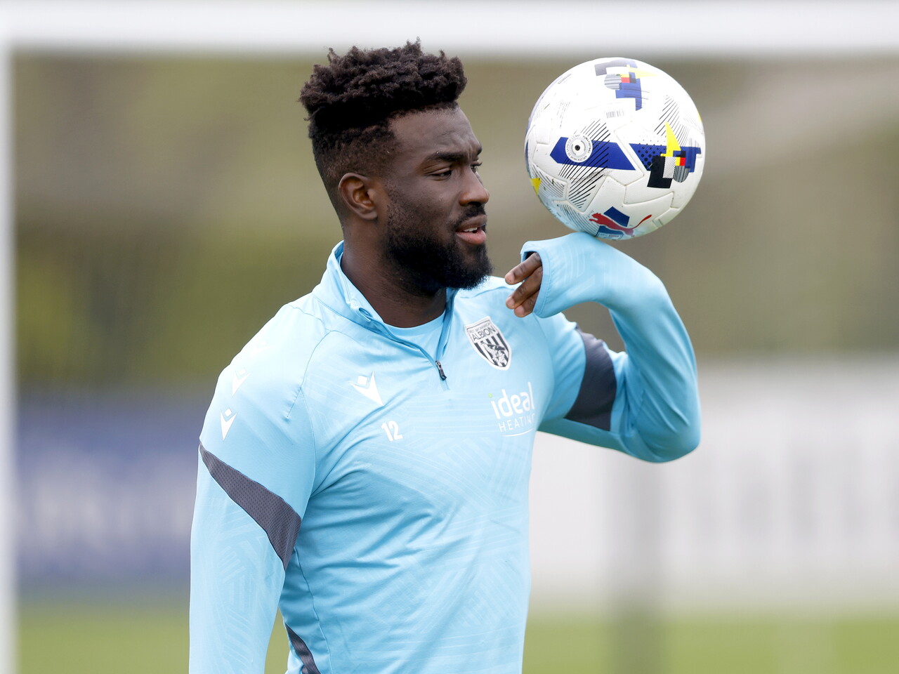 Daryl Dike with the ball close to his head during a training session