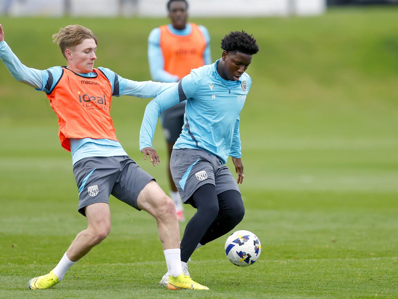 Ollie Bostock and Jamal Jimoh-Aloba battling for the ball during a training session