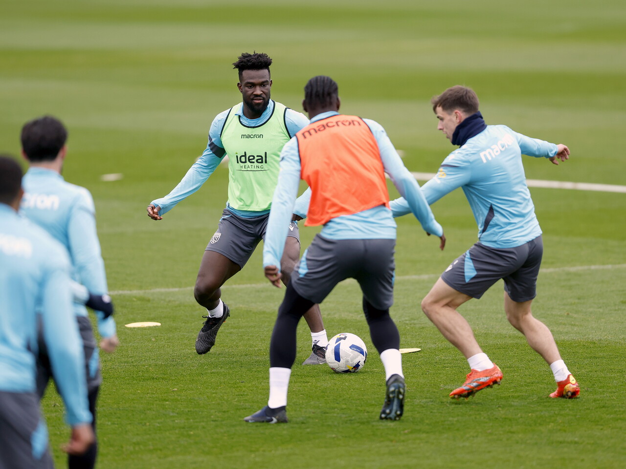Several WBA players battling for the ball in training 