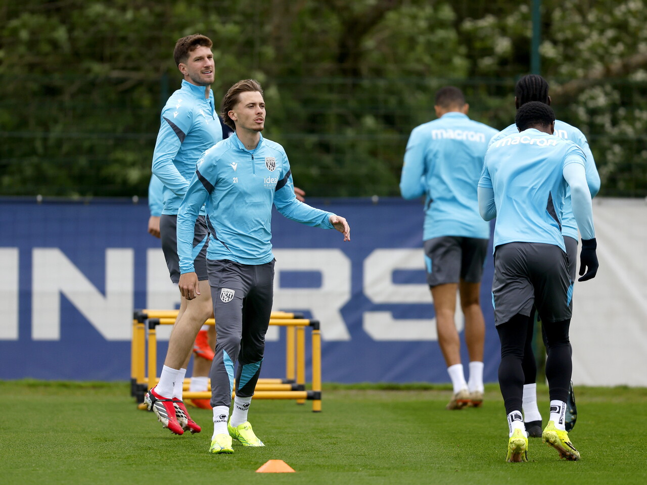Isaac Price and Chris Mepham warming up before a training session