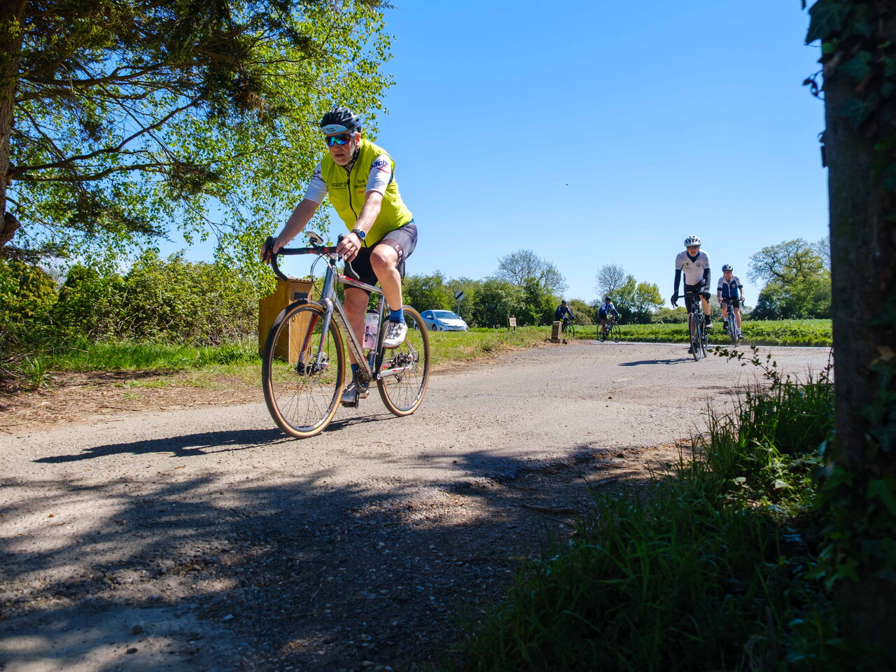 Steve Meeson riding down a country road.
