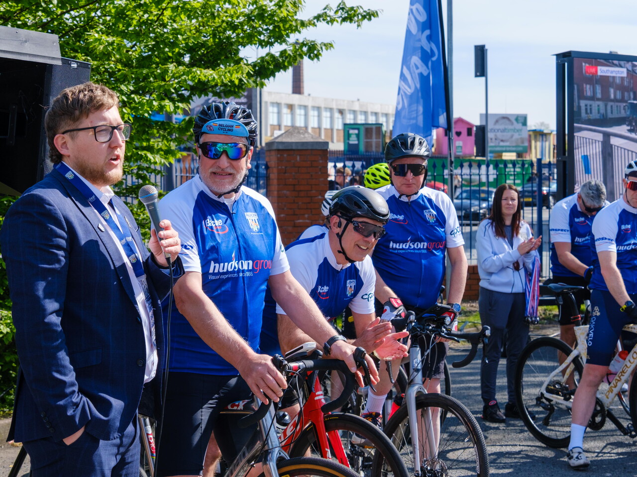 Deputy Director Jon Ward interviewing cyclists in the fanzone.
