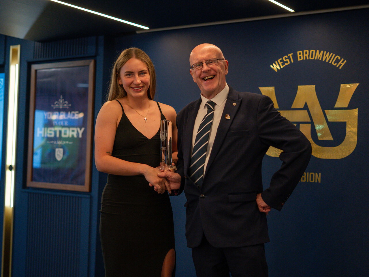 Monique Robinson collecting the Players' Player of the Season award.