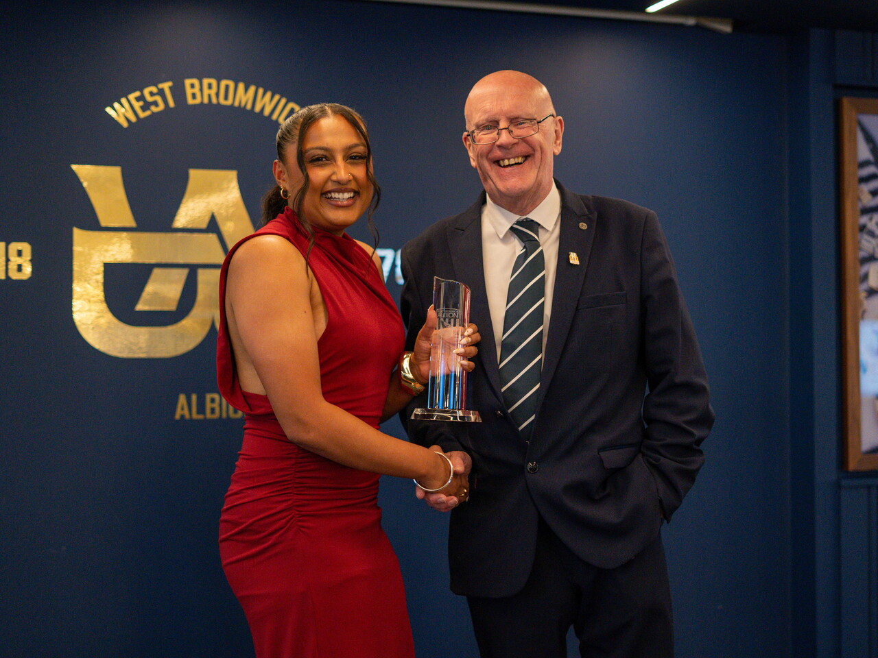 Simran Jhamat collecting the Supporters' Player of the Season award.