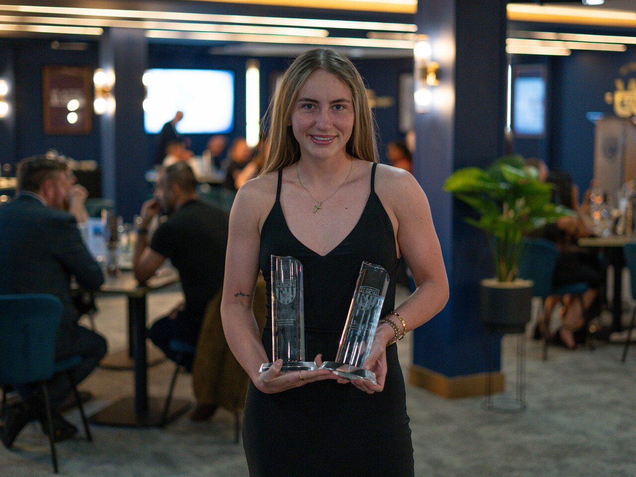 Monique Robinson collecting the Players' Player of the Season award.