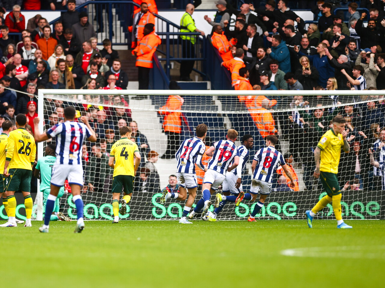 Josh Maja celebrates scoring a penalty with team-mates