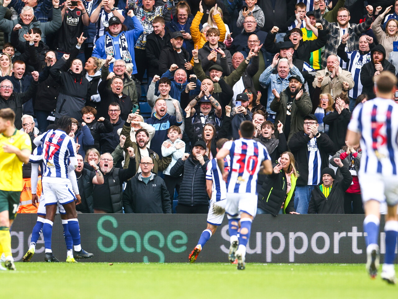 Josh Maja celebrates scoring a penalty with team-mates