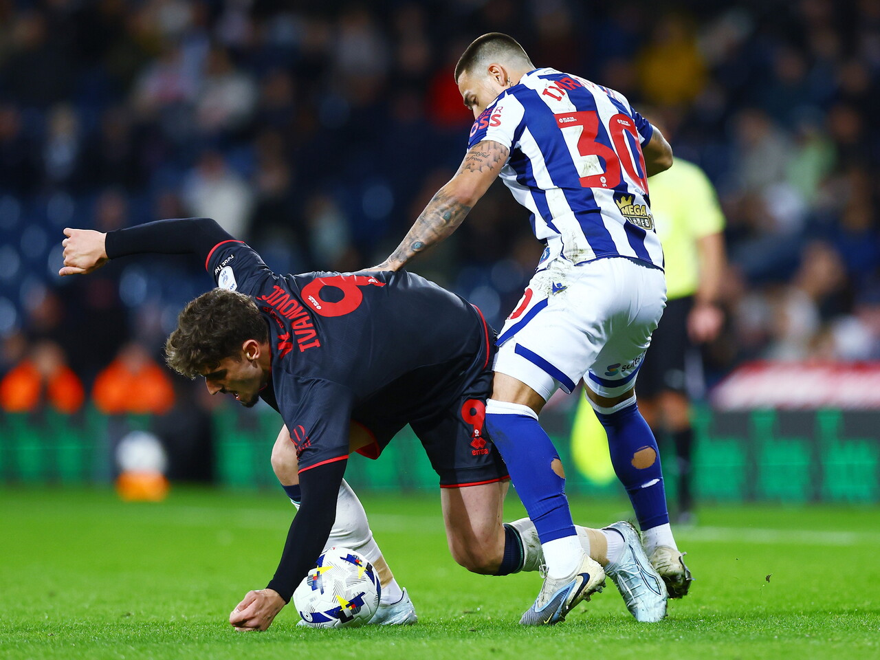 Danny Imray fighting to win the ball against Millwall