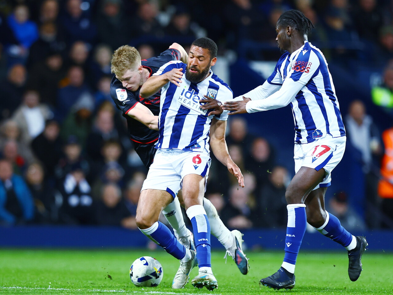 George Campbell fighting to win the ball against Millwall