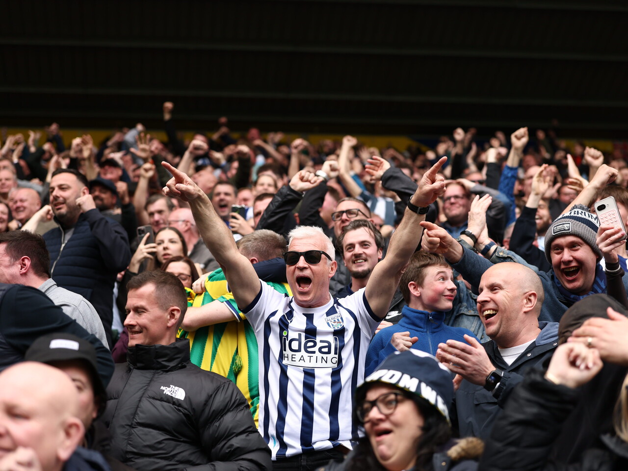 The Albion fans celebrate at full-time
